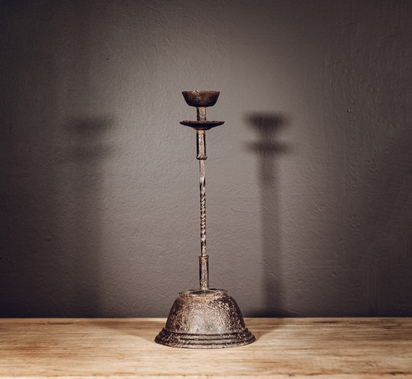 Cast iron candlestick with twisted stem